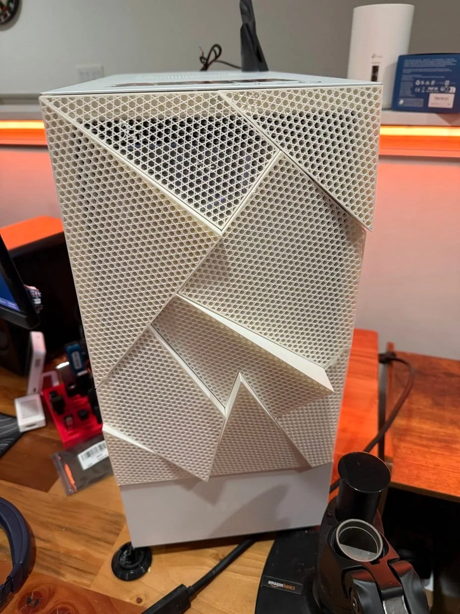 Close-up of the geometric low-poly mesh pattern on the custom NZXT front panel