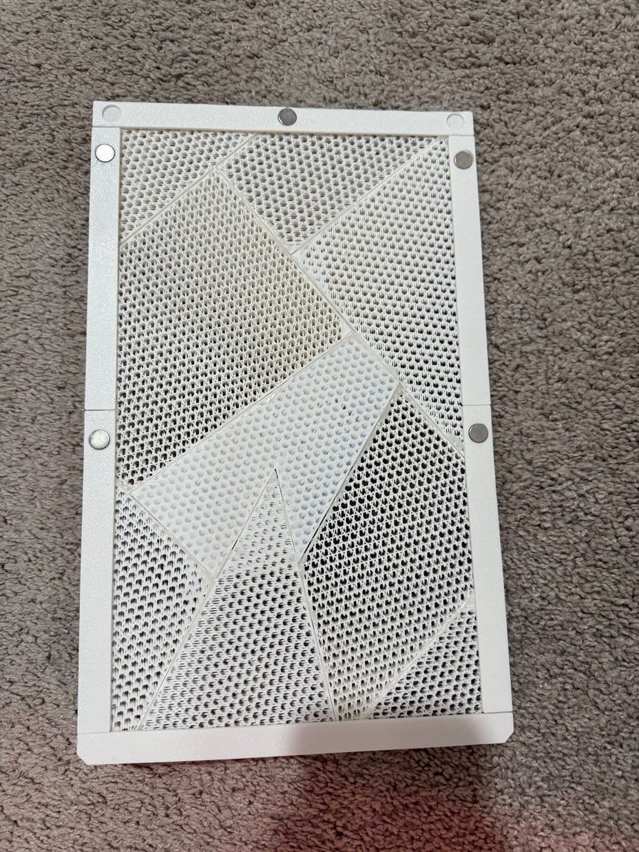 Frame pieces hot-glued together with low-poly panels positioned along the flange